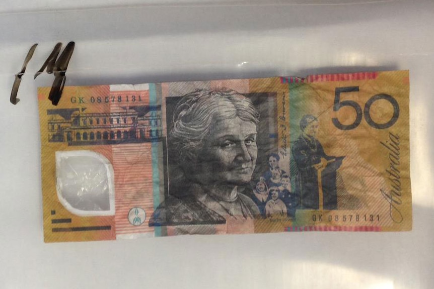 Police show counterfeit $50 note found in Townsville in north Queensland in October 2015