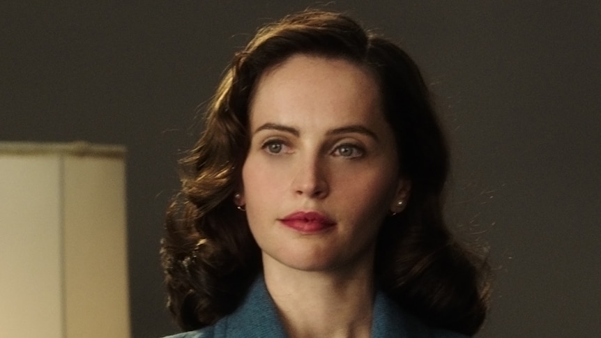 Colour still from 2018 film On the Basis of Sex of actor Felicity Jones portraying a young Ruth Bader Ginsburg.