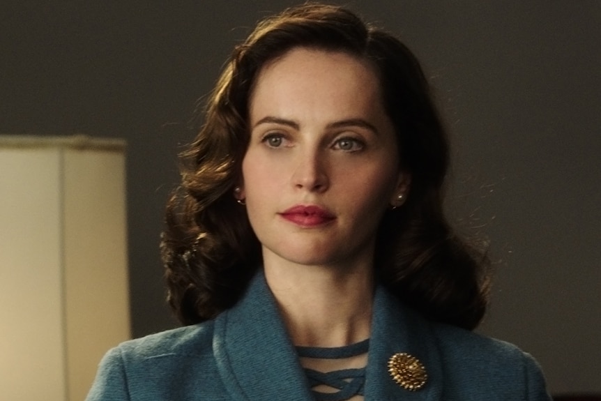 Colour still from 2018 film On the Basis of Sex of actor Felicity Jones portraying a young Ruth Bader Ginsburg.