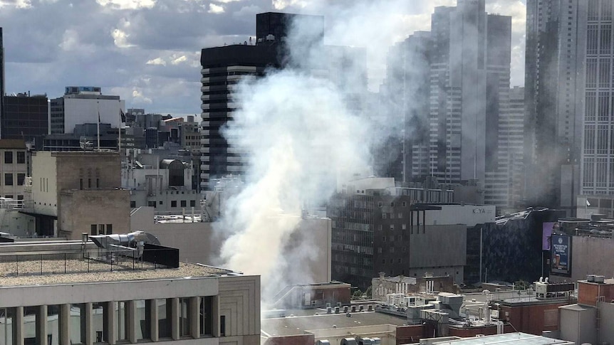 Smoke rises over the Melbourne CBD.