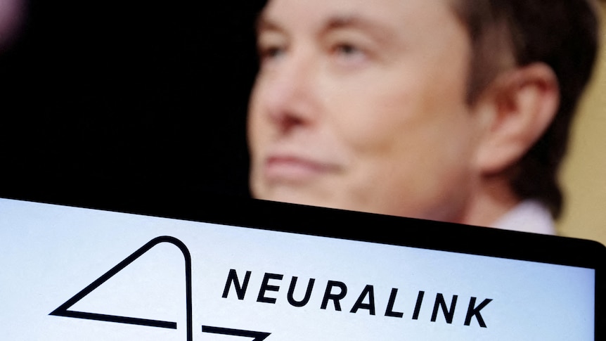 Elon Musks' face is pictured behind the logo for Neuralink.