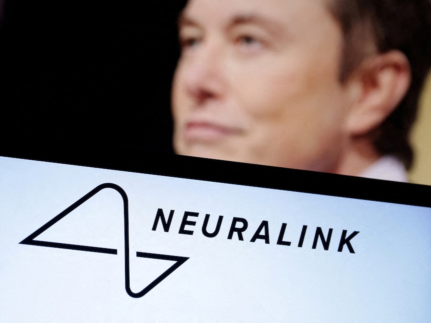 Elon Musks' face is pictured behind the logo for Neuralink.