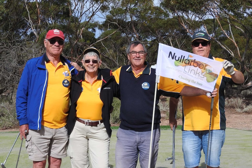 Four golfers on the Nullarbor Links golf course