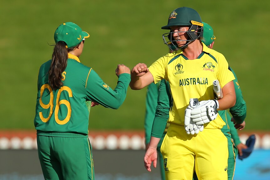 Meg Lanning and Sune Luus fist pump after the end of the game between Australia and South Africa