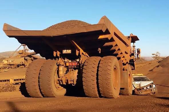 A mining truck at Rio Tinto's Brockman mine in the Pilbara almost crushes a 4WD.
