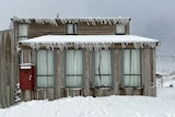 Snow and icicles cover a building on Ben Lomond.