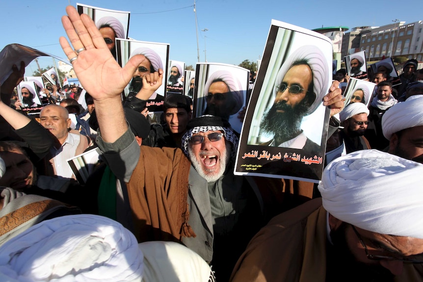 Iraqi men protest against the execution of Shiite Muslim cleric Nimr al-Nimr in Saudi Arabia