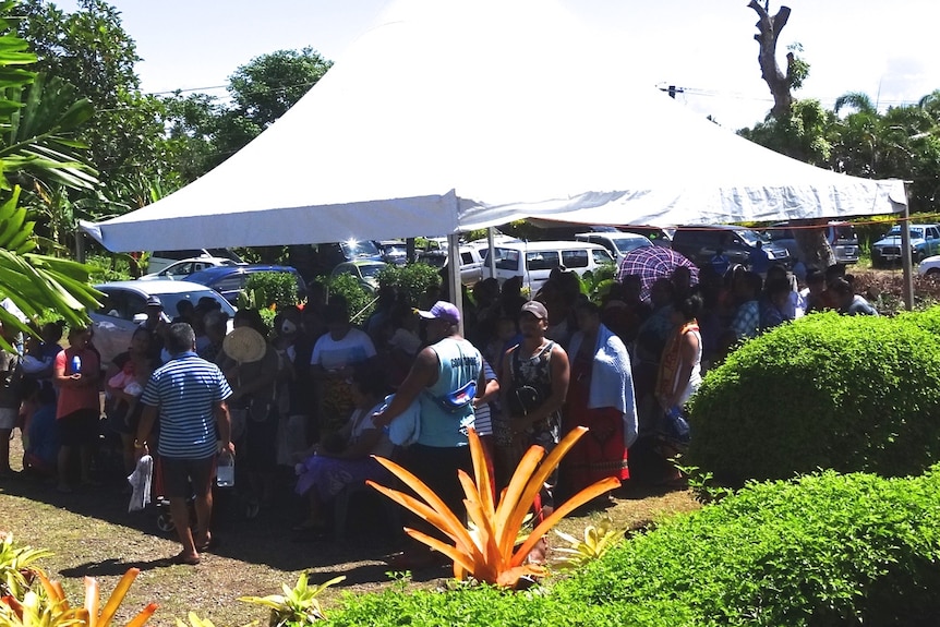 People line up to get sprayed with 'healing' water