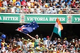 Cricket fans wave an Australian and an Indian flag at the Gabba