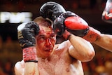 Boxer Tim Tszyu defends himself from the punches of Sebastian Fundora.