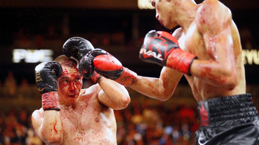 Boxer Tim Tszyu defends himself from the punches of Sebastian Fundora.