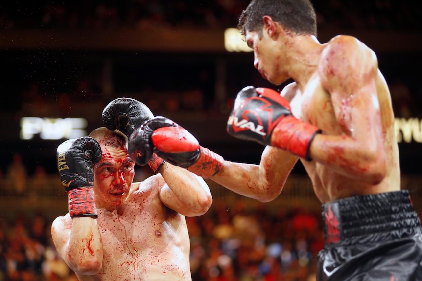 Boxer Tim Tszyu defends himself from the punches of Sebastian Fundora.