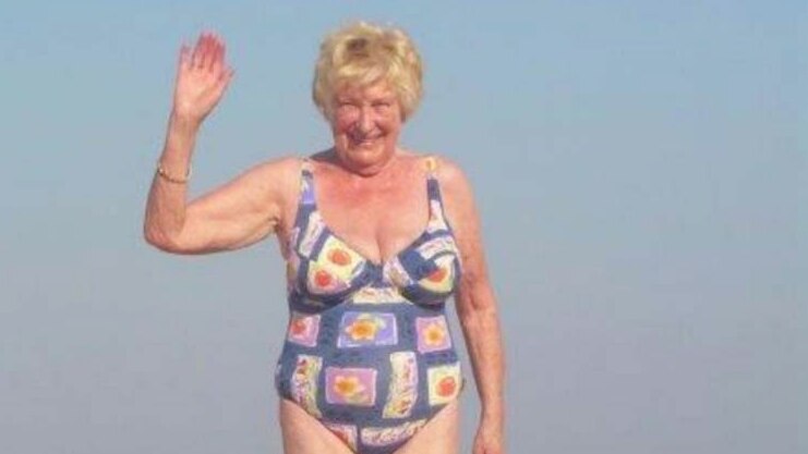 Older woman in bathing suit at the beach