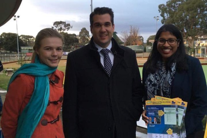 Stephanie Bastiaan, Michael Sukkar and Karina Okotel smiling in front of a bowling green.