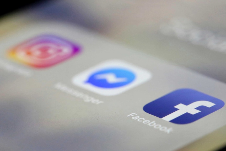 A close up, out of focus look at three social media app logos, Instagram, Messenger and Facebook
