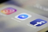 A close up, out of focus look at three social media app logos, Instagram, Messenger and Facebook