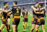 Broncos celebrate a try against the Roosters