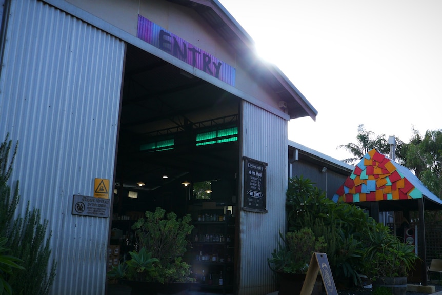 A picture of a shed-like building with a big sign that says "entry"