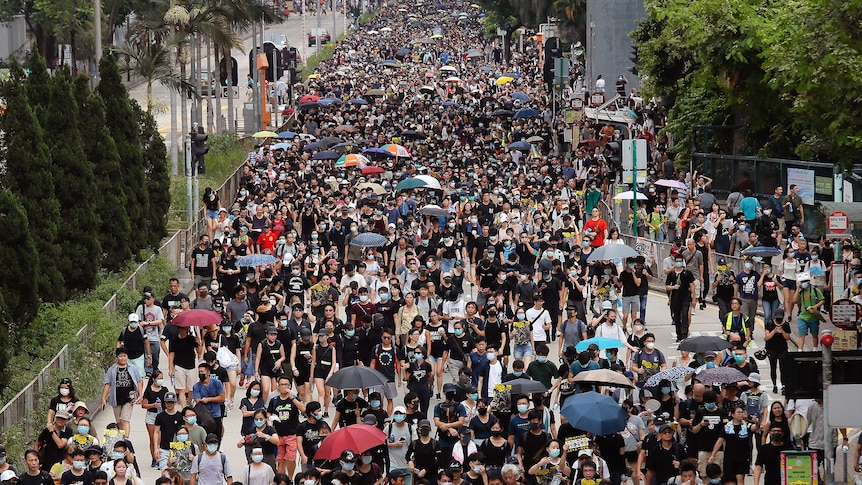 Residents take part in the anti-extradition bill protest march at Shum Shui Po in Hong Kong.