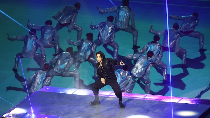 Jung Kook from BTS performs on a stage at the Qatar World Cup opening ceremony.