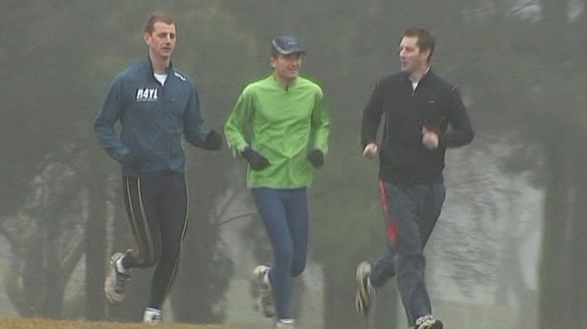 Out for a jog: Roy Daniell on a run with Julien Wicks and the ABC's Chris Kimball.