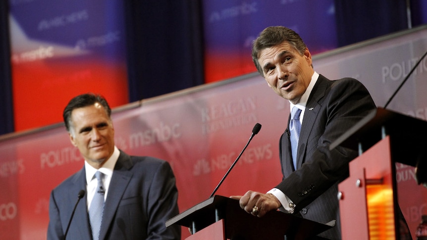 Mitt Romney and Rick Perry are shown before the Reagan Centennial GOP presidential primary debate in California