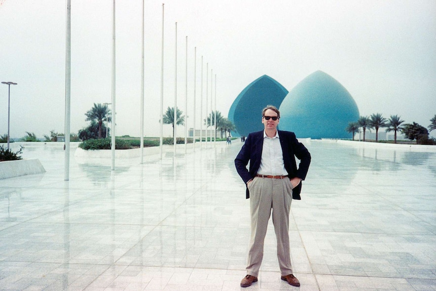 Mark Colvin at the multi-million dollar building in Baghdad 1990