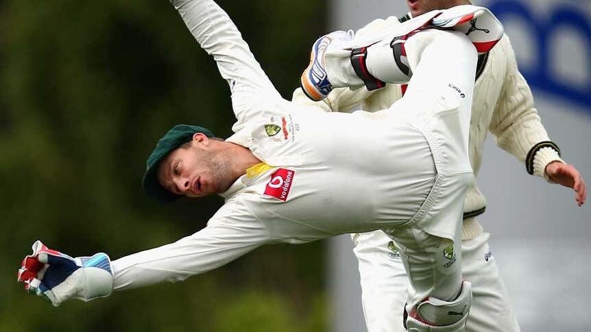 Australian wicket-keeper Matthew Wade dives for an edge on day four of the first Test in Hobart.