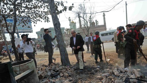 UN special envoy, Vijay Nambiar, inspects the rubble of destroyed buildings in Meiktila, Myanmar.