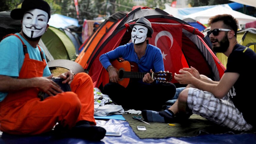 Protestors play music in Gezi park.