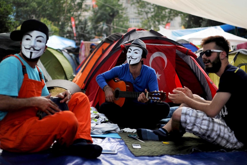 Protestors play music in Gezi park.