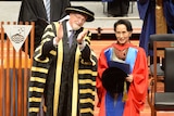 ANU vice-chancellor Gareth Evans presents Aung San Suu Kyi with her Doctorate of Letters.