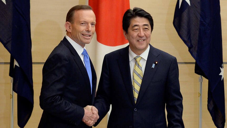 Tony Abbott and Shinzo Abe shake hands