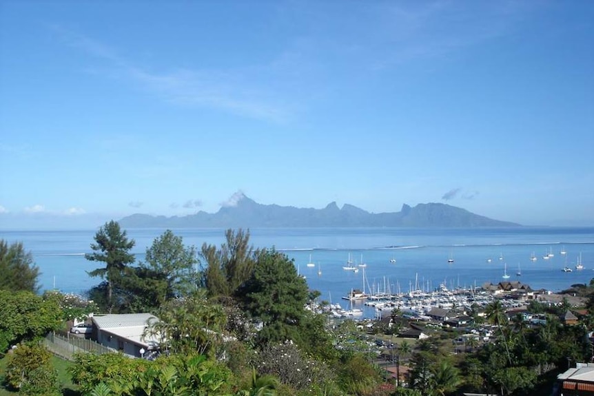 View from Residence Taina in French Polynesia. You can see a nearby island and the harbour.