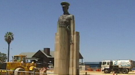 Sir Joseph Hobbs statue surrounded by heavy machinery in Perth