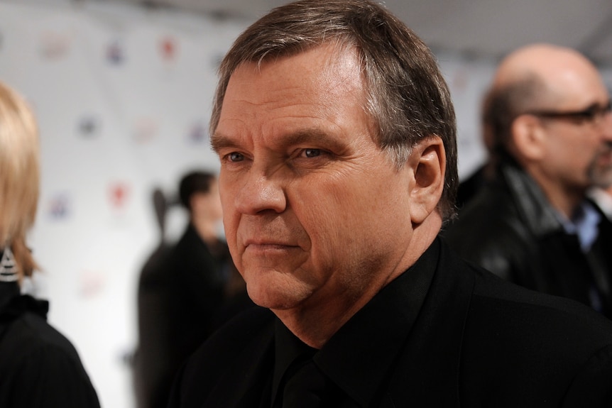 Close up of singer Meat Loaf looking composed