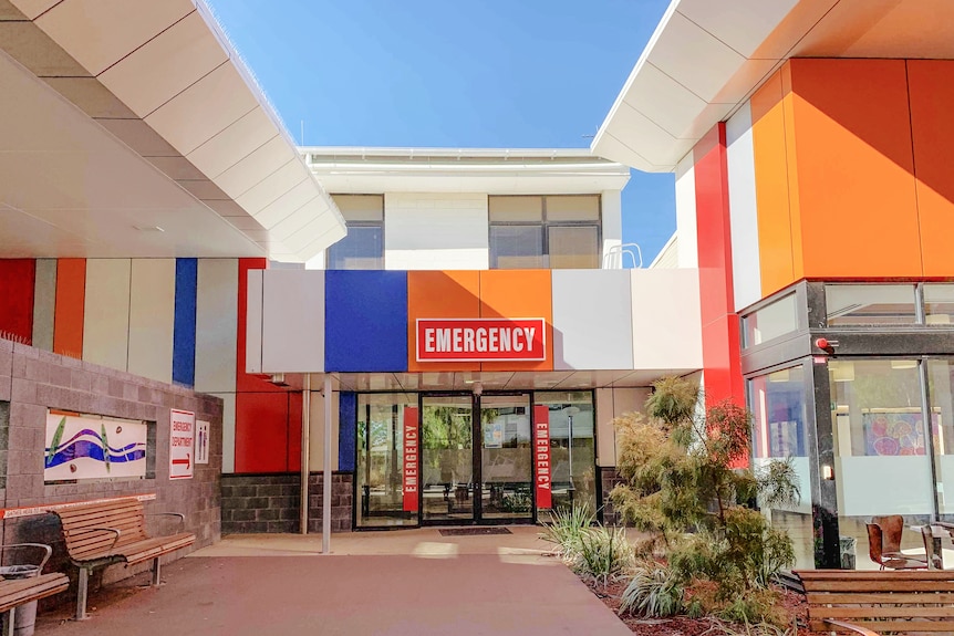 A bright blue and orange hospital building