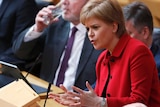 Nicola Sturgeon gestures with her hands as she speaks in Parliament.