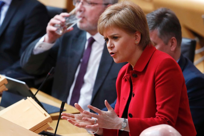 Nicola Sturgeon gestures with her hands as she speaks in Parliament.