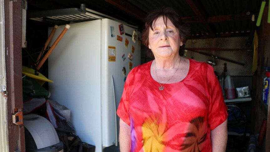 June Hope with the household belongings stored in her sister's shed.
