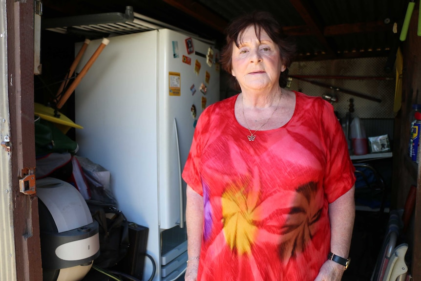 June Hope with the household belongings stored in her sister's shed.