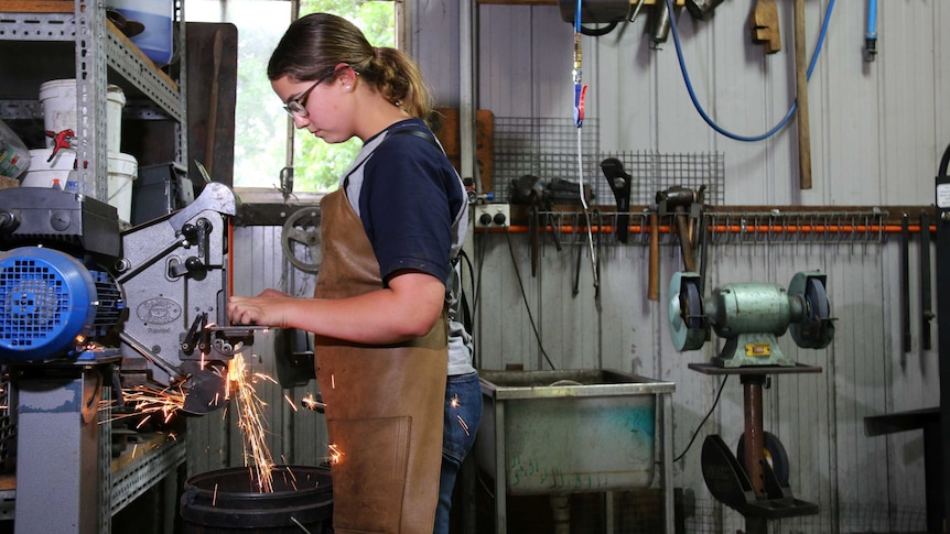 Leila Haddad making a knife at her blacksmith forge in Tharwa.