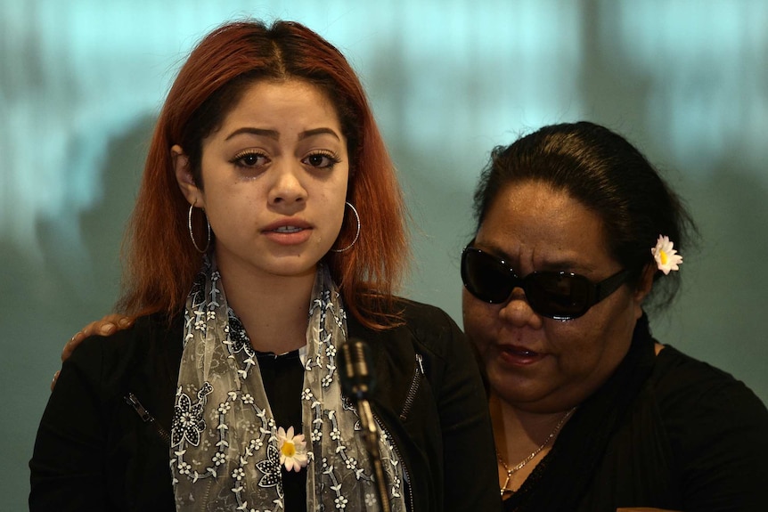 Rosalia Mason (left) speaks during the funeral