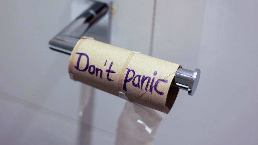 toilet paper roll with words don't panic written on it