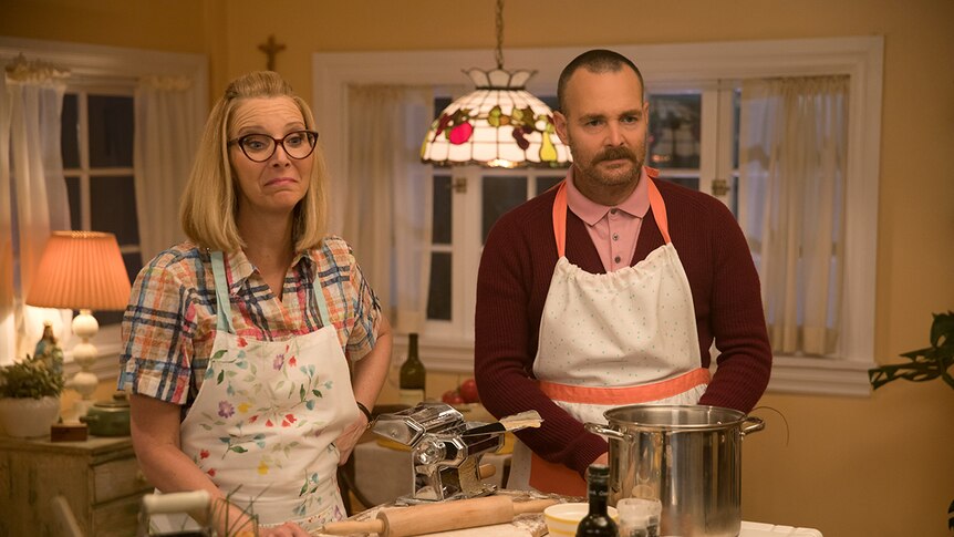 Colour film still of Lisa Kudrow and Will Forte cooking in kitchen in 2019 film Booksmart.