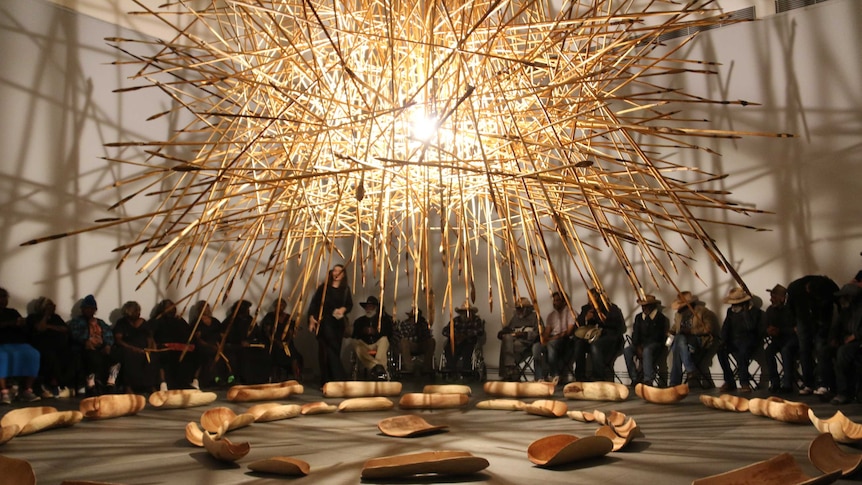 An Aboriginal art installation featuring hundreds of hanging spears.