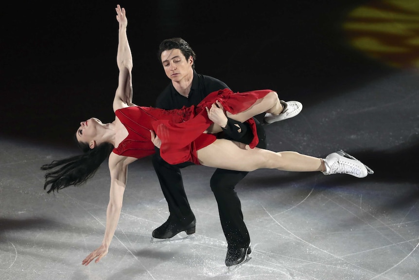 Tessa Virtue and Scott Moir of Canada perform on the ice.