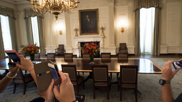 Tourists take pictures in the White House