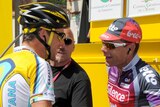 Lance Armstrong chats with Cadel Evans before the start of stage 12.