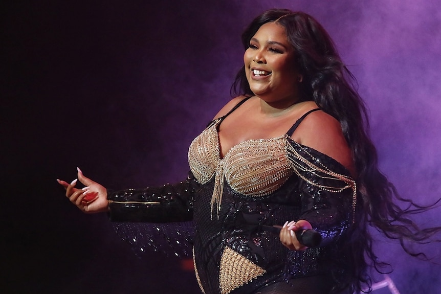 Pop singer Lizzo appears on stage.